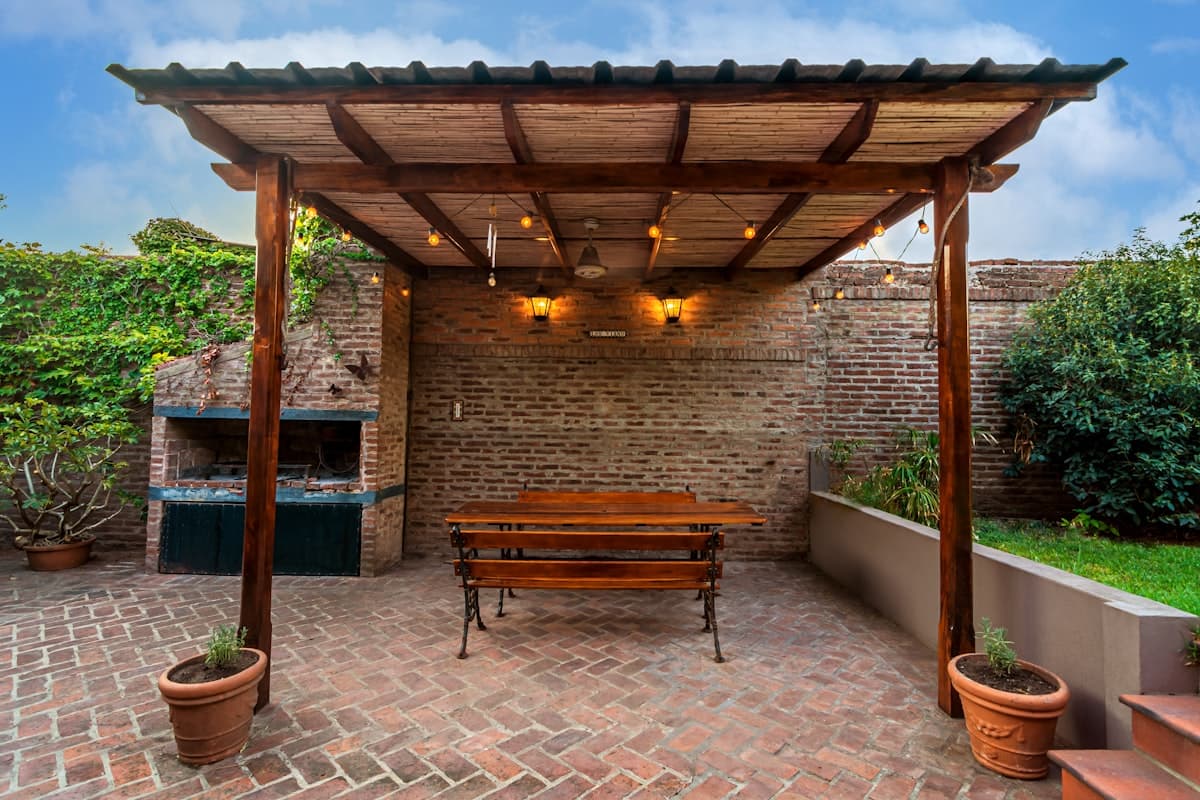 Wooden pergola over an outdoor seating area